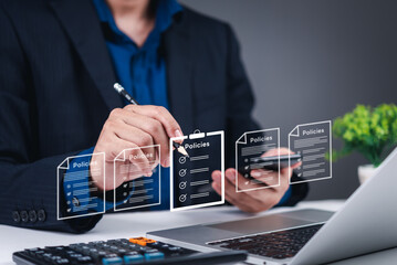 Businessman reviewing and checking corporate policies on digital documents. Perfect for policy management, business compliance, document approval, and corporate governance visuals.