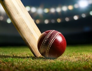close-up of cricket ball being hit by a cricket bat