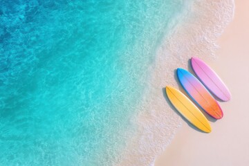 Obraz premium Aerial beach photo with surfboards on sand and crystal water in background