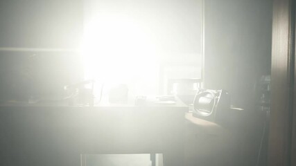 Light adjustment showing photography equipment on desk