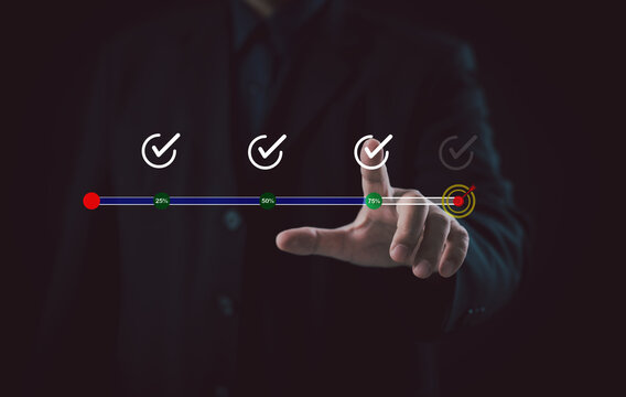 Business success goal achievement concept. Businessman hand selecting checklist icon with progress bar, symbolizing effective planning, task completion, performance evaluation, and target success.