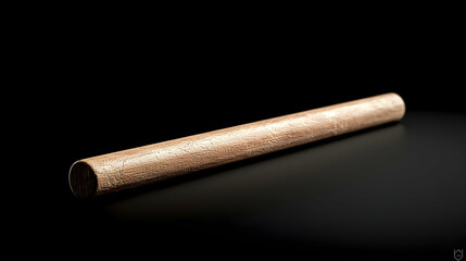 Light Brown Cylindrical Tube Object On Dark Background