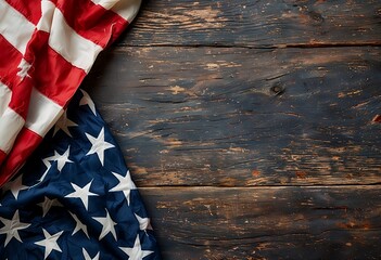 a draped american flag lies on a rustic, dark wooden surface with ample space for text or design elements.
