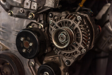 Disassembled car dirty engine and dynamo at garage