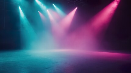 Bright pink and cyan spotlights illuminate an empty stage floor through atmospheric haze, creating a dynamic contrast and vibrant mood for performance or presentation backgrounds.
