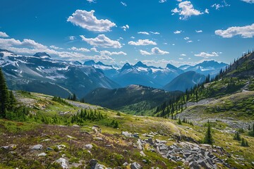 Fototapeta premium Panoramic View Of Green Mountain Range With Snowy Peaks And Blue Sky