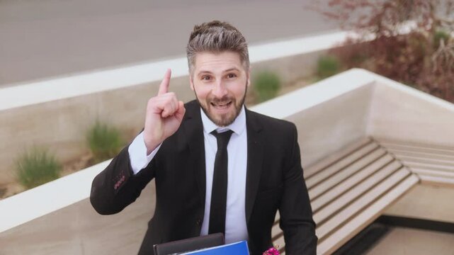 happy Man expressing excitement after having a great idea in a professional setting