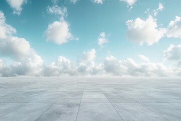 Empty paved area under a partly cloudy sky