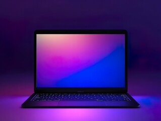 An open laptop displays a vibrant pink and blue gradient wallpaper, dramatically illuminated from below by purple light reflecting on the surface in a dark setting.