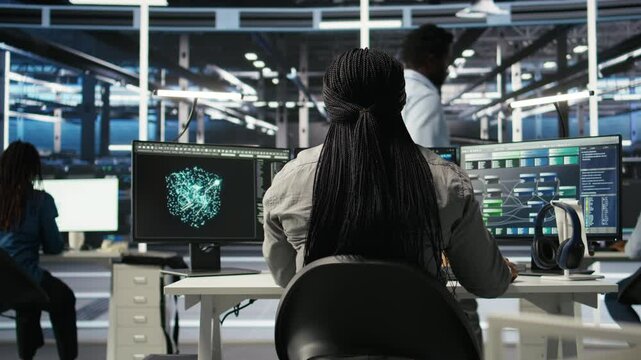 Data center worker applies deep learning node tree programming to analyze datasets for operational insights. Server hub admin uses visual programming to identify patterns in facility data, camera A