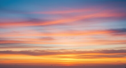 Obraz premium Vibrant Sunset Sky with Orange Pink and Blue Clouds