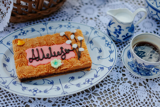 Easter mazurek cake and coffee on the table with beautiful porcelain and tablecloth