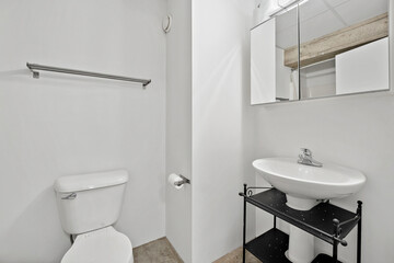 Bathroom with a white toilet and sink