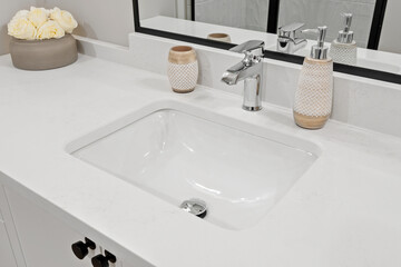 Bathroom sink with a silver faucet and a white porcelain basin