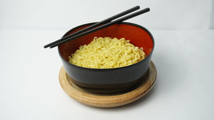 Noodles in a black bowl