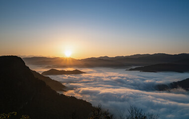 In the quiet hours of dawn, the sun awakens a sea of clouds in Xindian, Taiwan, painting the sky with hues of gold and creating a dreamlike realm.