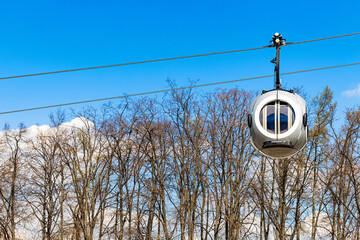 A cable car with round passenger cabins. 