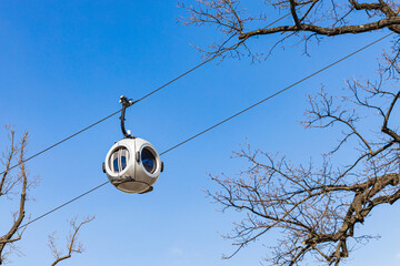 A cable car with round passenger cabins. 