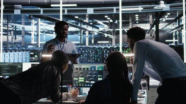 Server hub engineering team working together, using node tree software to optimize system health. Data center teamworking colleagues brainstorming equipment issues using AI visualization, camera A
