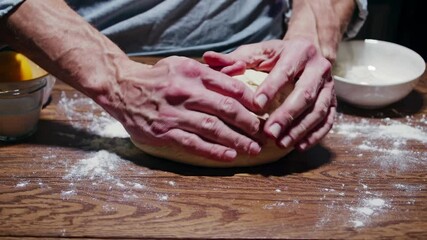Baker's expressive powerful movements pressing dough onto floury wooden table, portrays passion, confidence in rustic culinary skills; emphasizes vitality cooking food creative lifestyle