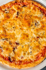 Pizza funghi with tomato sauce, mozzarella and fresh mushrooms