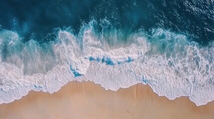Fototapeta premium Aerial View of Ocean Waves Crashing on Sandy Beach