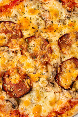 Close up view on Appetizing pizza cheese, corn, mushrooms and ham on gray background. Italian cuisine.