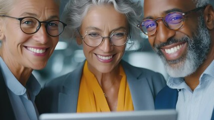 Business Team Smiling After Reviewing Tablet Data. A diverse group of professionals in suits shares a joyful moment after analyzing results on a tablet in an office. - Powered by Adobe