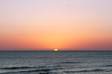 Sunsets Over Beaches, Palm Trees and Oceans
