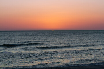 Sunsets Over Beaches, Palm Trees and Oceans