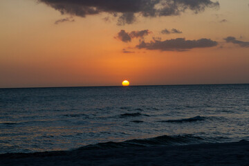 Sunsets Over Beaches, Palm Trees and Oceans