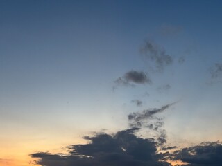 Beautiful sky with natural gradations. Thick clouds in the dusk sky on a winter night. Image of a cloudy sky in the afternoon. View of the night sky with golden light from the evening sun