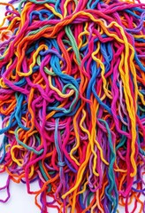A vibrant, overflowing bobina of tangled colorful threads and yarns, colorful threads, intricate, handmade
