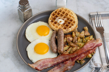 fried eggs with waffles  top with melted butter and  syrup