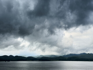 Large lake and mountain with cloudy dark sky
