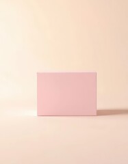 A pale pink box subtly contrasts against a similarly hued background, delicate, backdrop