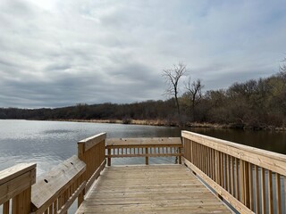 Naklejka premium wooden bridge over lake
