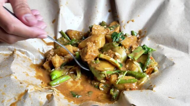 Rujak ulek. Indonesian salad, rice cake with various vegetables, peanut sauce and shrimp paste.