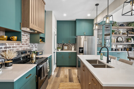 Kitchen with a green color theme and a white countertop