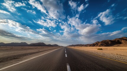 Naklejka premium Desert Road Under Blue Sky