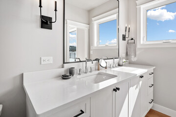Bathroom with a white sink and a mirror