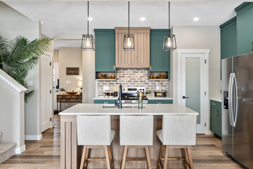 Kitchen with a white counter and a green wall