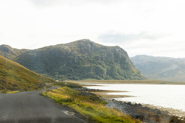 Winding through the Scottish Highlands, the road unveils green pastures, roaming wildlife, and vast unspoiled landscapes. A journey through raw beauty, freedom, silence,nature, timeless wilderness.