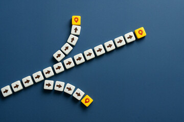 Multiple Paths to Success Strategic Planning Concept Yellow Arrows Business Navigation Goals Achievement Direction Options Choices Route Destination Journey White Cubes Blue Background Top View future