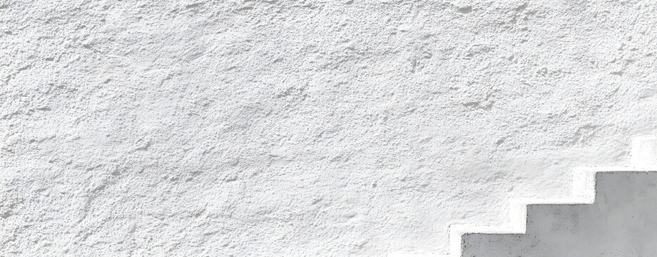 White rough concrete wall texture background providing copy space