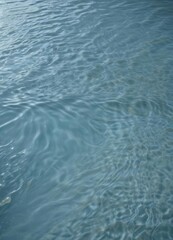 Obraz premium Serene light blue water, gentle undulations, subtle ripples , tranquility, peaceful, background