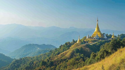 Golden pagodas atop a misty mountain range.