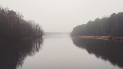 Tranquil lake surrounded by trees under a cloudy sky