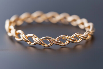 Obraz premium Gold chain bracelet with braided design, representing elegance, luxury, and craftsmanship. Fashion and lux jewelry and accessories.