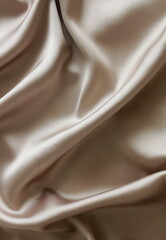 Silk texture beige brown color, abstract, drapery fabric, textile top view background template with copy space. 